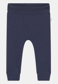 Mörkblå bomullsleggings med ribbad textur. Utrustad med elastisk midja och åtsittande muddar vid anklarna. Inga synliga mönster eller grafik.