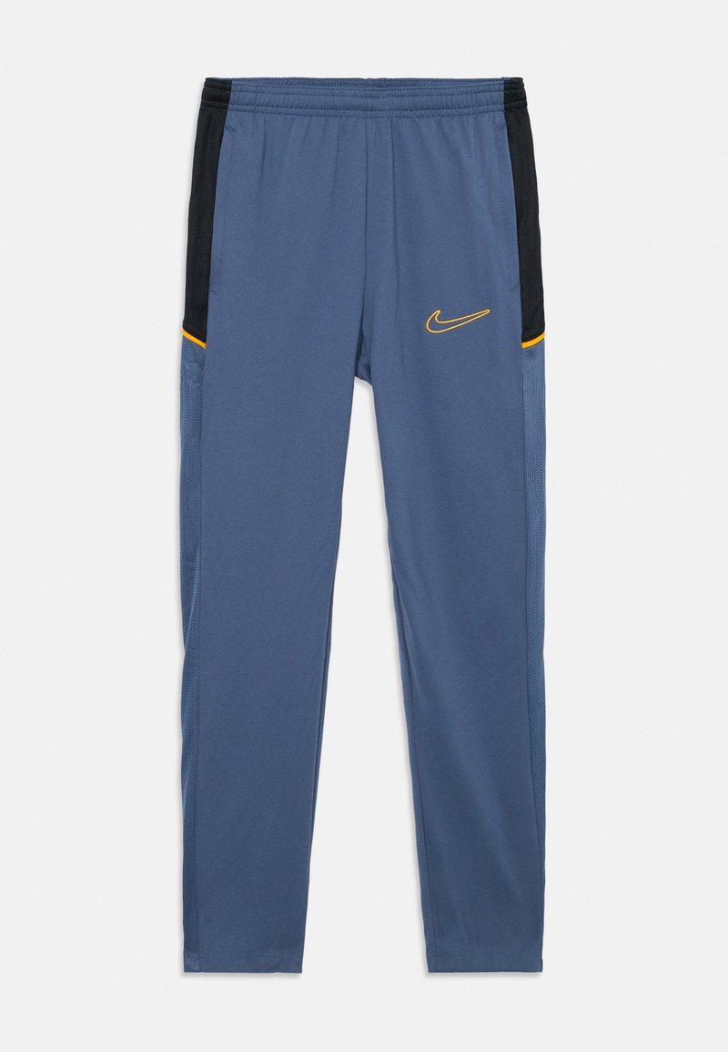 Nike treningsbukser i blått med svarte sidestykker og gule detaljer. Har en teksturert midjebånd og sidelommer for enkel tilgang.