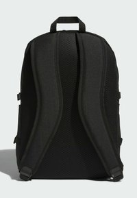 Zaino nero con pannello posteriore in rete testurizzata, spallacci imbottiti e maniglia superiore. Design minimalista senza loghi visibili.