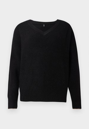 Pull en maille noire avec un col en V, des manches longues et une texture côtelée. Présente un bord contrastant sur les poignets.