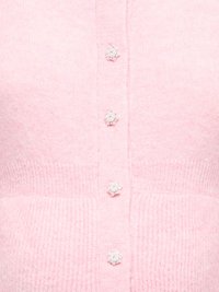 Soft pink knitted cardigan with four decorative pearl and bead flower-shaped buttons down the center.