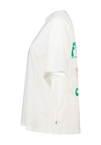 White cotton T-shirt with short sleeves, featuring green and orange printed text on the back. Loose fit, round neckline, and side slit detail.