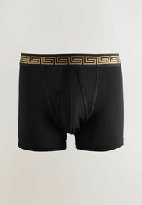 Schwarze Boxer-Shorts aus weichem Stoff mit einem goldenen geometrischen Muster am Bund, ausgestattet mit einem konturierten Pouch und genähten Details.