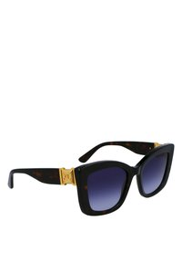 Zonnebrillen met oversized vierkante monturen in donker schildpad, gradient donkere lenzen en goudkleurige hardware accenten met een logo.