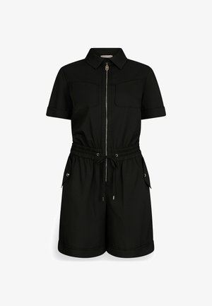 Jumpsuit nero a maniche corte con zip frontale, due tasche sul petto, vita elastica e risvolti. Realizzato in tessuto morbido con una vestibilità rilassata.