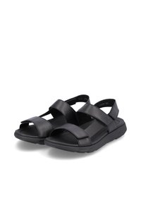 Sandales noires avec fermetures à sangle réglables, design ouvert à l'avant, semelle en caoutchouc, matériau synthétique lisse et semelle intérieure rembourrée.