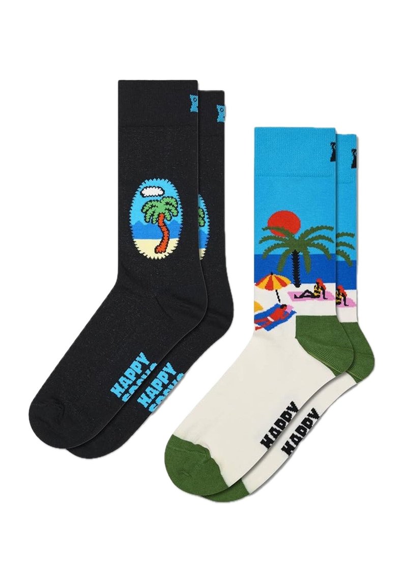 Zwei Paar Baumwollsocken: ein Paar schwarz mit einem Palmenmuster, das andere mit einer Strandlandschaft in Blau, Creme und Grün, mit lebendigen Farben.