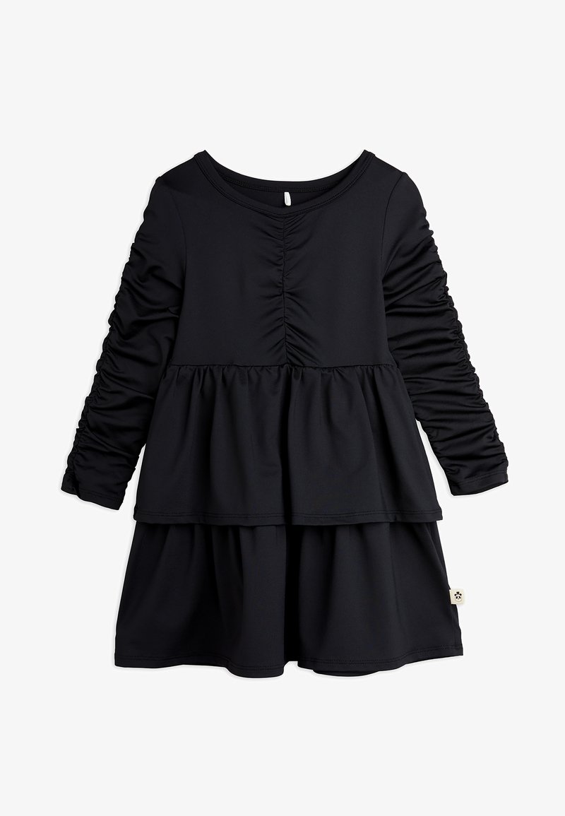 Svart langermet kjole med innsamlede detaljer, en flippet nederdel og rund hals. Laget av mykt, elastisk materiale.