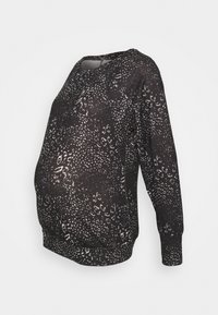 Zwarte zwangerschaps sweatshirt met een wit dierenprintpatroon. Het heeft een ronde halslijn en geribbelde manchetten, ontworpen voor een relaxte pasvorm.