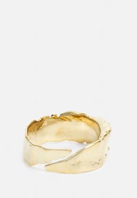 Gold-colored ring with an organic, textured design featuring curved edges and irregular shapes, enhancing its contemporary look.