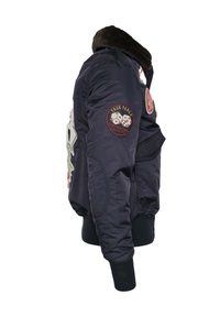 Dunkelblau bomberjacke mit einem Kunstfellkragen, die verschiedene Patches, einschließlich 'TASK FORCE', zeigt. Sie verfügt über gerippte Bündchen und ein strukturiertes Material.