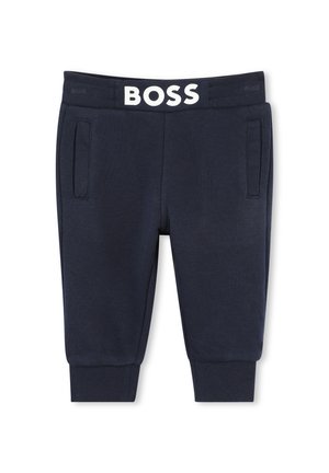 Navy sweatpants with a ribbed texture, featuring front pockets and a white elastic waistband with "BOSS" logo prominently displayed.