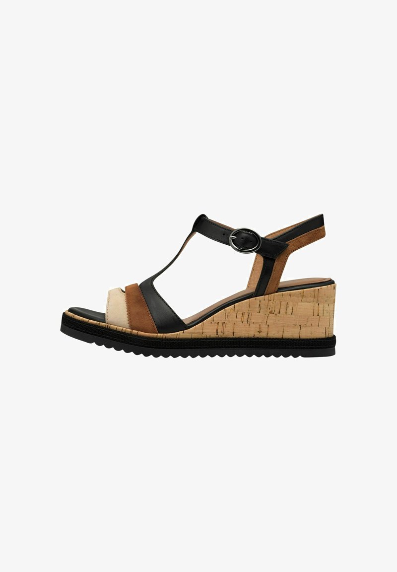 Sandale compensée avec des brides noires, marron et beiges, une semelle intermédiaire en liège, un design ouvert aux orteils et une sangle de cheville réglable.