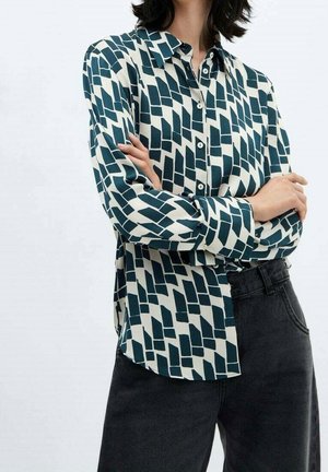 Gemustertes Hemd in Creme und Dunkelblaugrün mit geometrischem Design aus wechselnden Formen, durchgehender Knopfleiste und langen Ärmeln.