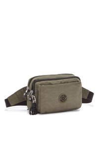 Olive green fabric pouch with dual zippers, front pocket, and logo patch. Features a dark brown strap and a black monkey keychain accent.