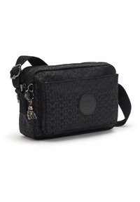 Black crossbody bag made of durable fabric, featuring a geometric pattern, zip closure, front pocket, and a small charm attached to the zipper.