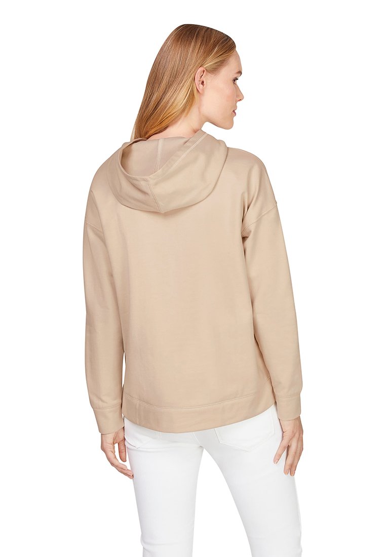 Beige Kapuzensweatshirt mit lässiger Passform, weichem Gefühl und gerippten Manschetten. Verfügt über eine Kängurutasche und einen tiefen Saum hinten.
