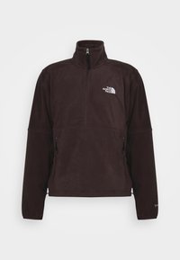 Pullover in pile marrone scuro con collo mezza zip, con logo bianco sul petto e tasche laterali con zip. Tessuto morbido e testurizzato.
