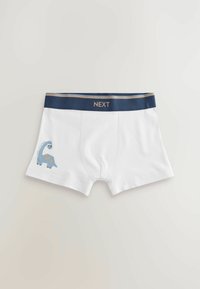 Vita bomullboxershorts med en blå dinosaurdesign på vänster ben, med ett marinblått midjeband och guldtexten "NEXT."