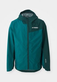 Veste imperméable turquoise avec capuche, fermeture éclair, poignets élastiques et inscription « RAIN.RDY » sur la manche. Fabriquée à partir d'un matériau léger et durable.
