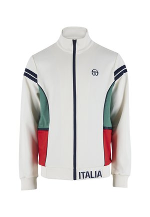 Hvid jakke med lynlås, grønne og røde sidepaneler, marineblå striber på ærmerne, teksten "Italia" på kanten og lille cirkulært logo på brystet.