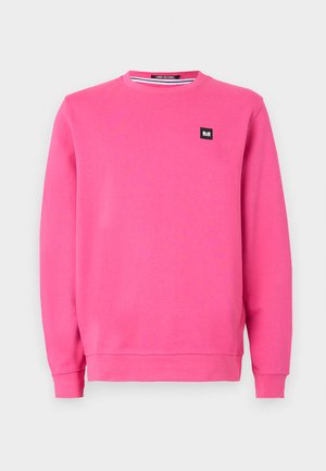 Felpa rosa realizzata in morbido tessuto, caratterizzata da un colletto a girocollo, maniche lunghe, polsini a costine e una piccola etichetta nera sul davanti.