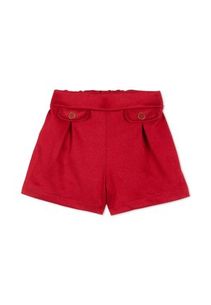 Short rouge taille haute avec deux poches avant à rabat, chacune fermée par un petit bouton marron.
