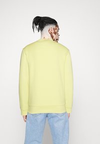 Lacoste UNISEX - Felpa - yellow