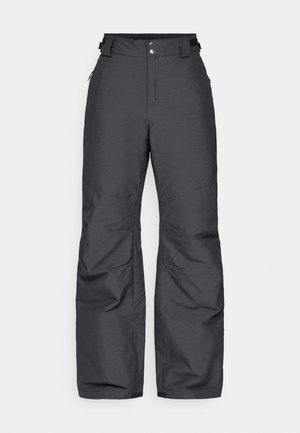 Mustad soe saapad, reguleeritavate vöökohtade, esikäepidemete ja jalgade õmbluste detailidega, disainitud külmade ilmade jaoks.