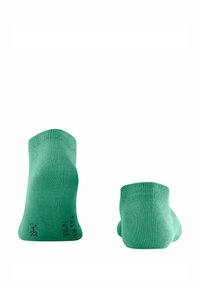 Grüne Knöchelsocken mit glatter Textur, featuring einen gerippten Bund und schwacher Markenkennzeichnung. Das Design ist schlicht und nahtlos.