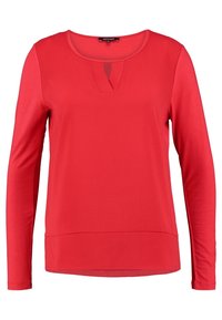 Red long-sleeve women's top with round neckline and small V-shaped notch at the center front.