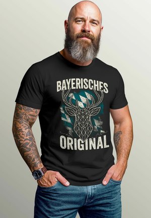 Black t-shirt featuring a geometric deer head graphic in white and teal with the text "BAYERISCHES ORIGINAL." Short sleeves and round neckline.