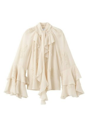 Blusa color crema con cuello alto con volantes y lazo, mangas campana en capas y sutil bordado floral en toda la tela.