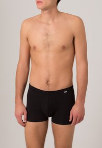 Svarta boxershorts i stretchig tyg, med en åtsittande design, elastisk midjeband och en liten logotyp på främre vänstra sidan.