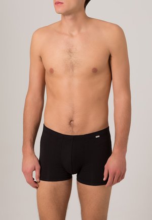 Schwarze Boxershorts aus dehnbarem Stoff, mit einem engen Schnitt, elastischem Bund und einem kleinen Logo auf der linken Vorderseite.