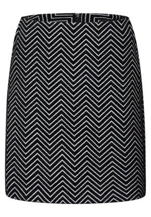 Jupe noir et blanc avec un motif en chevrons, fabriquée à partir d'un tissu texturé. Elle possède une taille et un détail de couture à l'arrière.