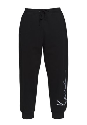 Black sweatpants made of cotton, featuring an elastic waistband with drawstring, tapered legs, and a white logo design on the left side.