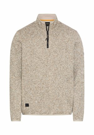 Strikket beige og lys brun half-zip sweater med stående krave, lange ærmer og en lille sort rektangulær mærke tæt på kanten.