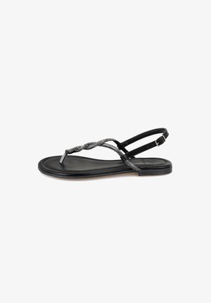 Schwarze Sandalen mit flacher Sohle, geflochtenen silbernen Riemen und einer verstellbaren Knöchelsschnalle für einen sicheren Sitz.