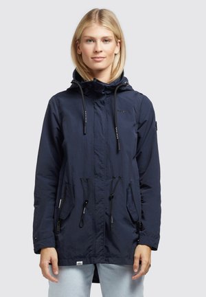 Navy blue lightweight jacket with a hood, drawstring waist, and two front pockets. Made from a textured fabric with a casual fit.