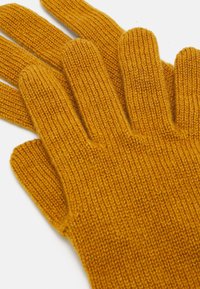 Knit gloves in a rich mustard yellow color, featuring ribbed texture and five finger design with a soft finish.