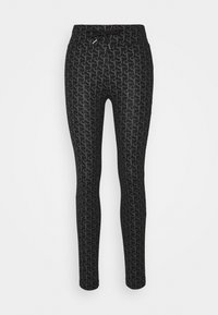 Svarta leggings med ett upprepande grått mönster, lätt material, elastisk midja med dragsko och en figurnära passform.