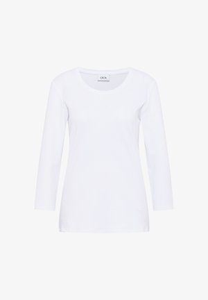 Biała damska koszula z długim rękawem i okrągłym dekoltem, oznaczona marką "Cecil", prezentowana na białym tle.