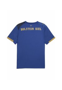 Maglia sportiva blu con maniche corte, con un pannello nero e dettagli dorati. "HOLSTEIN KIEL" stampato in grassetto sul retro.