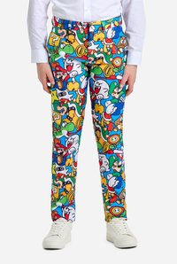 Bunte Hose mit einem dicht gemusterten Design, das verschiedene Cartoon-Charaktere zeigt, aus einem Stoff mit glatter Textur.
