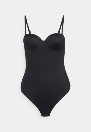 Maillot de bain une pièce noir lisse avec de fines bretelles réglables et des bonnets moulés, présenté sur un fond blanc uni.