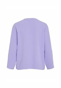 Haut à manches longues uni violet clair avec un col rond, vu de dos sur fond blanc.