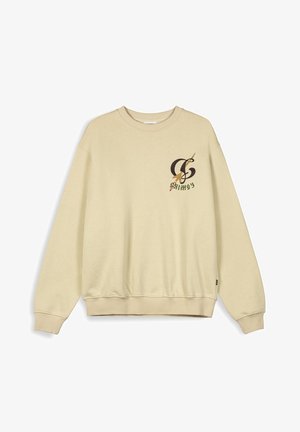 Crème-kleurige sweatshirt met een ronde hals, lange mouwen, geribbelde manchetten en onderkant. Heeft een grafisch ontwerp op de linkerborst.