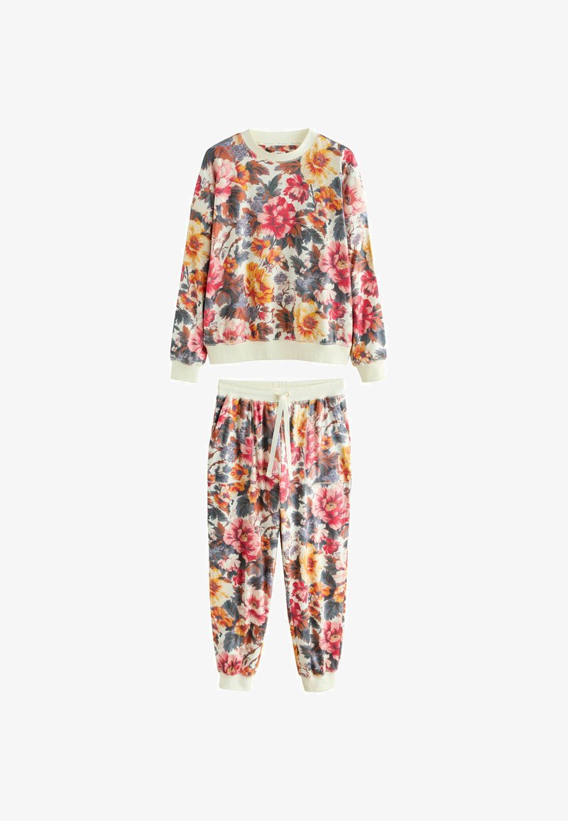 Completo felpa e pantaloni jogger con stampa floreale, caratterizzato da vivaci fiori rossi, gialli e blu su uno sfondo crema. Tessuto morbido, polsini e vita elasticizzati.