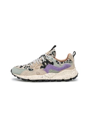 Low-top athletic shoe with beige, green, and purple suede panels, leopard print fabric, white laces, and speckled white sole with black tread.